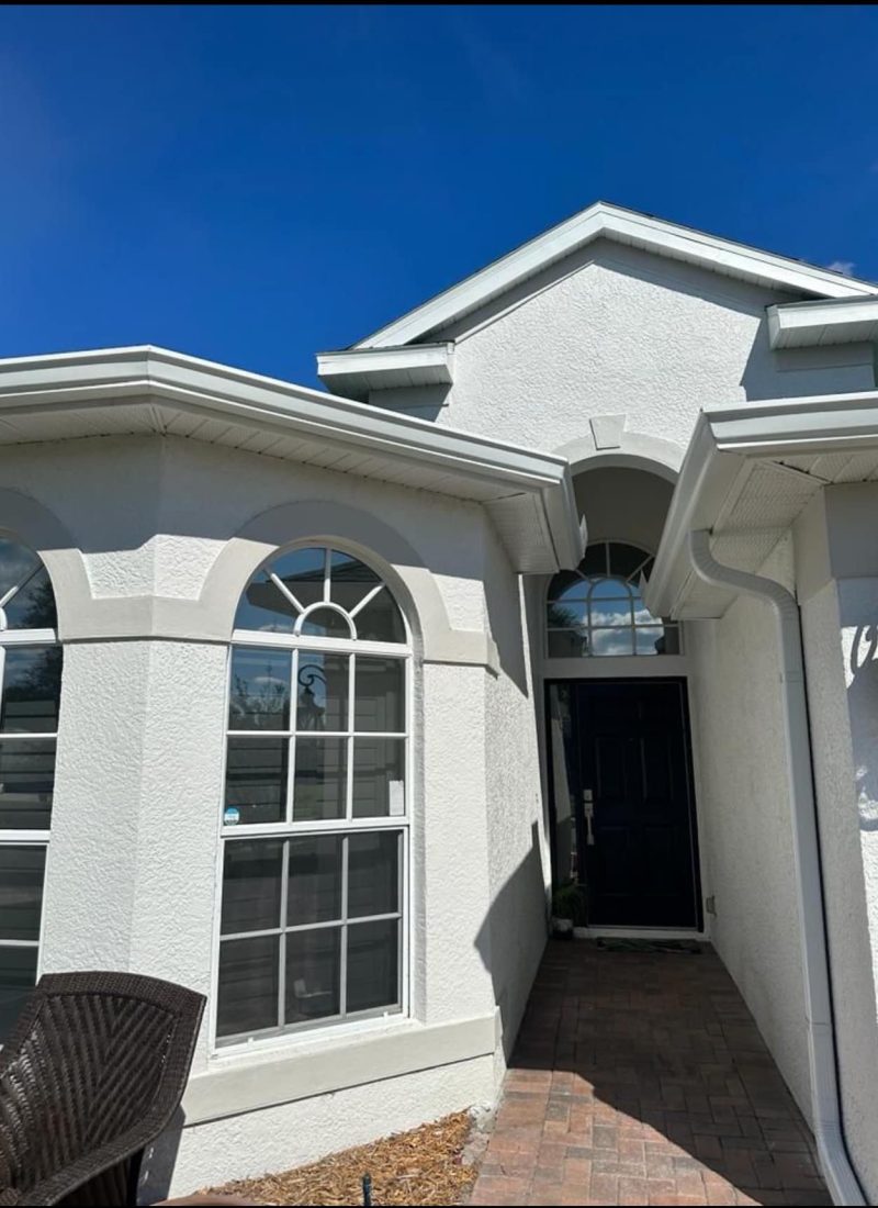 An entryway into a central florida home with beautiful seamless gutters